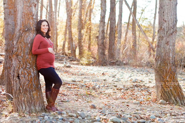 mama leaning on tree in forest clearing, Fall Maternity Session with Matt & Cristina in Ellensburg WA, authentic rustic lifestyle photography by Hailey Haberman