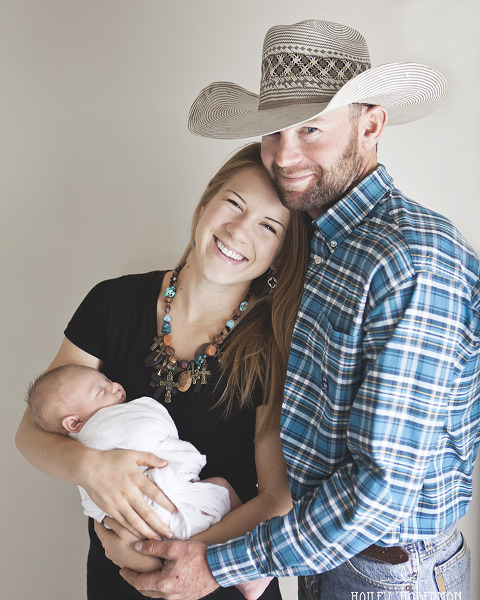cowboy with wife and baby boy, rustic and natural posed newborn photography in Ellensburg WA by Hailey Haberman