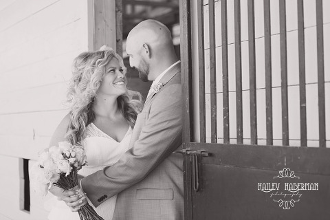 Nisqually Springs Farm Country Wedding candid photo of bride and groom in stable