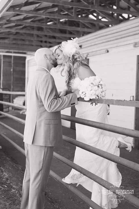 Nisqually Springs Farm Country Wedding photo of bride and groom kissing in stable