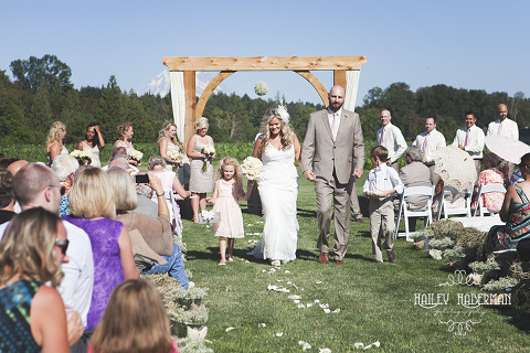 Nisqually Springs Farm Country Wedding Ceremony with gorgeous view MT Rainier behind couple walking down aisle