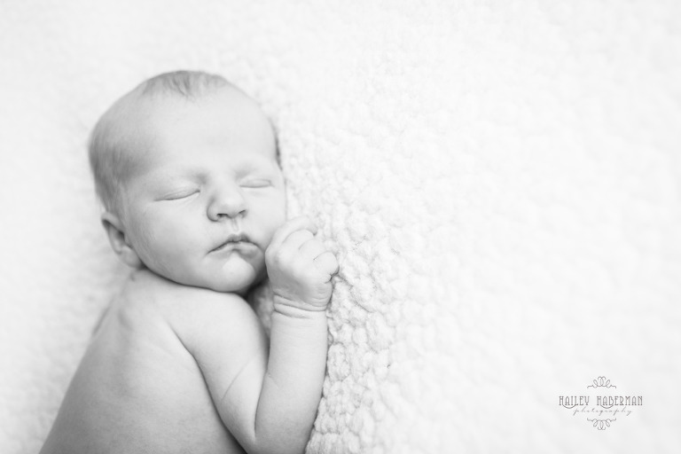 Ellensburg Newborn Photographer captures Baby Boy Ryle asleep in on tummy in black and white 