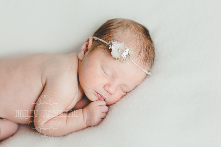 Nora Newborn session photo of baby asleep on tummy