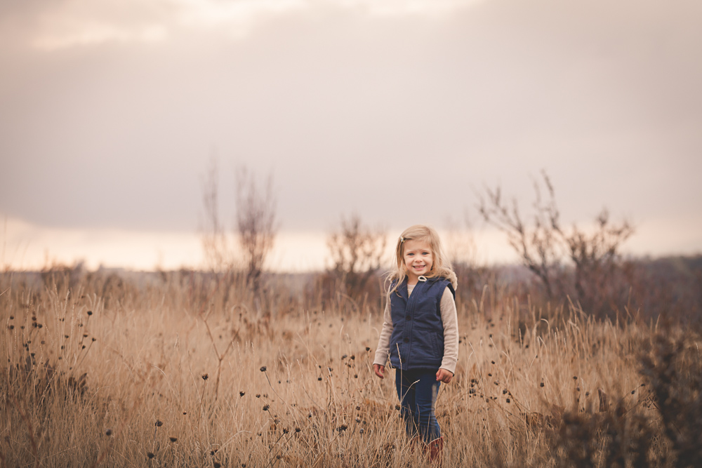 little girl smiling in fall rustic open field - cle elum children photography