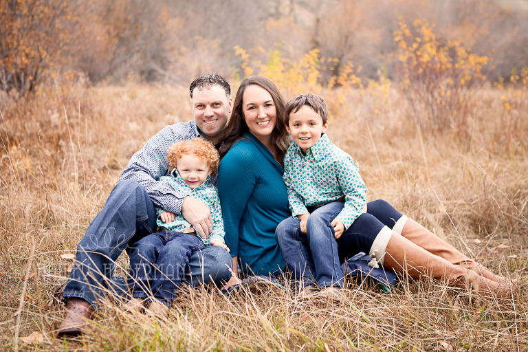 Fall lifesyle family session by Ellensburg Photographer Hailey Haberman with Russ and Danae photo of family smiling at camera