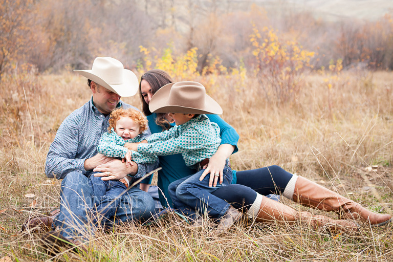 Fall lifesyle family session by Ellensburg Photographer Hailey Haberman with Russ and Danae photo of family laughing