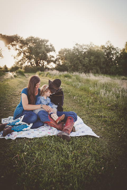 family snuggled on blanket, Ellensburg Maternity Session with Megan & Kyle at Olmstead State Park in Ellensburg WA by Hailey Haberman Lifestyle Family Photographer