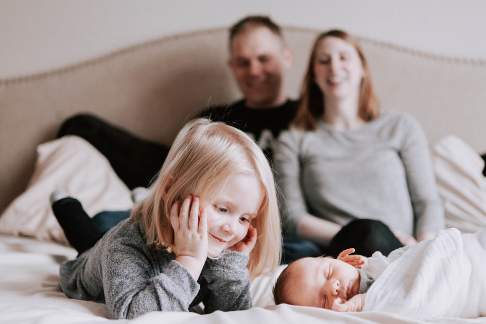 family with new baby at home- lifestyle newborn photography by Hailey Haberman in Ellensburg WA